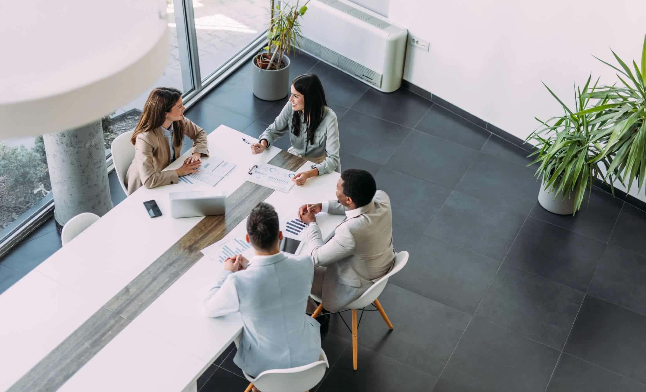 Consulting team meeting around a conference table